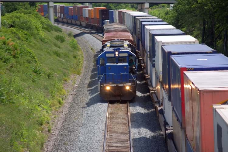 Industrial Switching Locomotive Beside Intermodal Cars